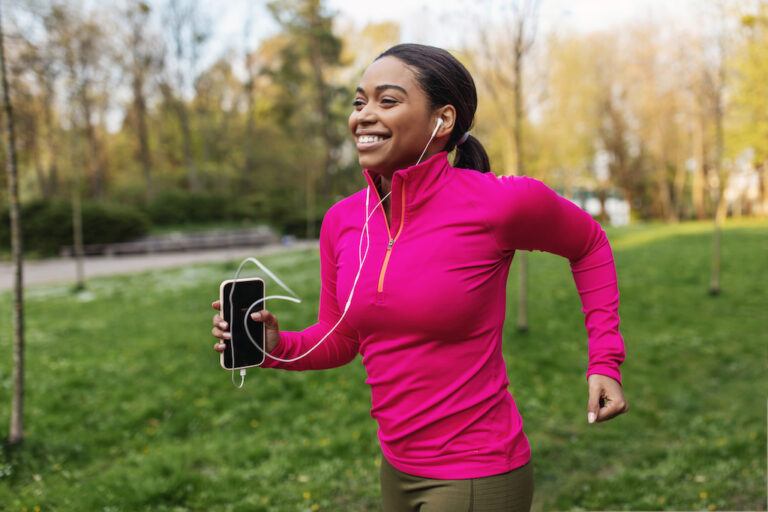 Black woman walking in park